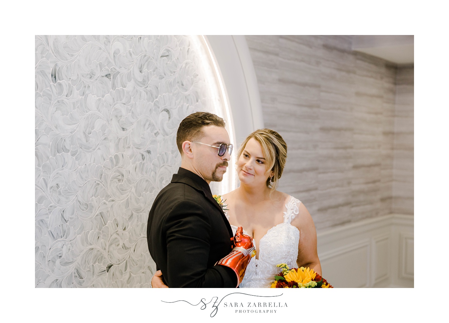 bride smiles at groom in Tony Stark sunglasses inside Rhode Island venue 