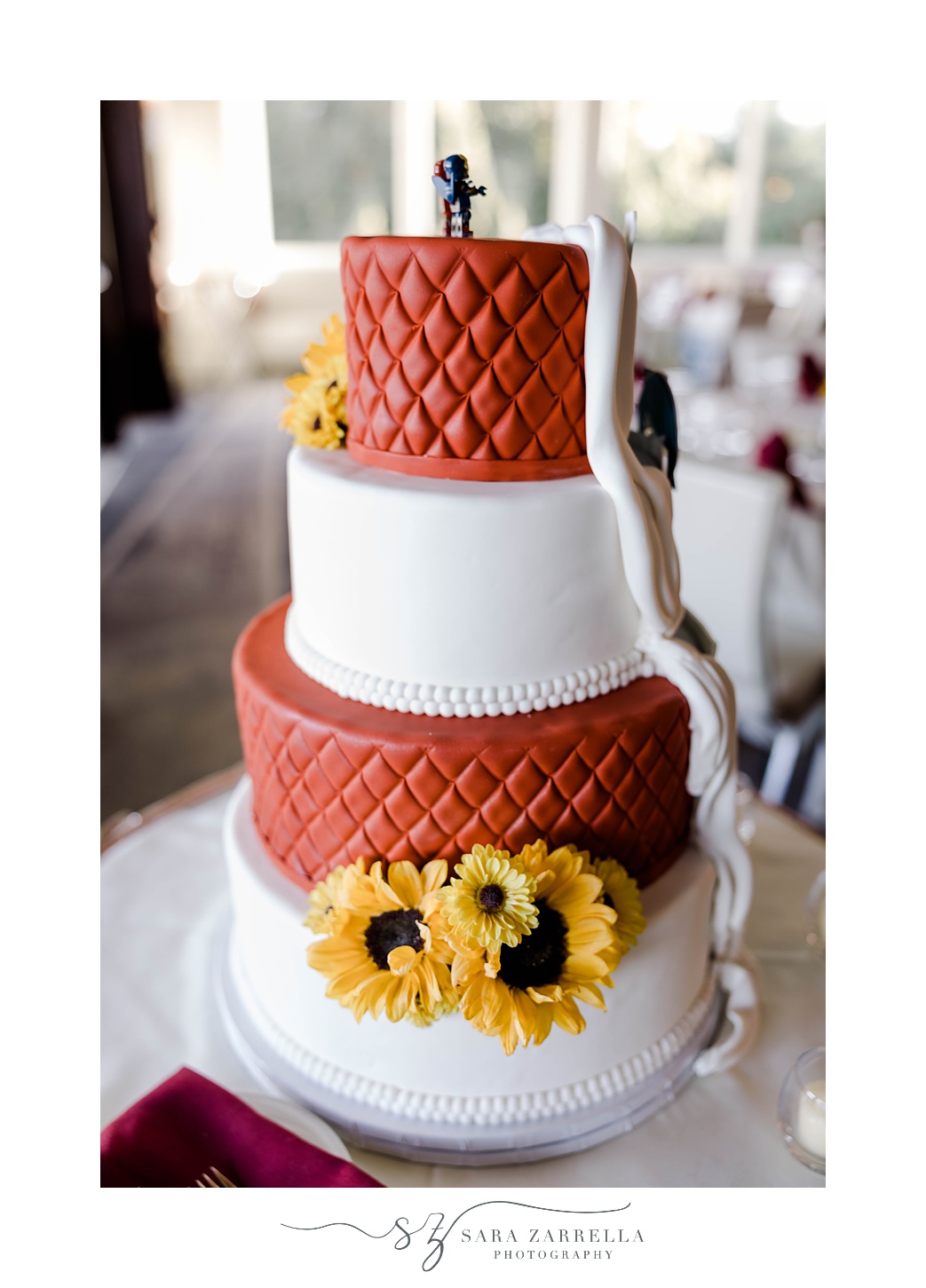 front of wedding cake with sunflower accents 