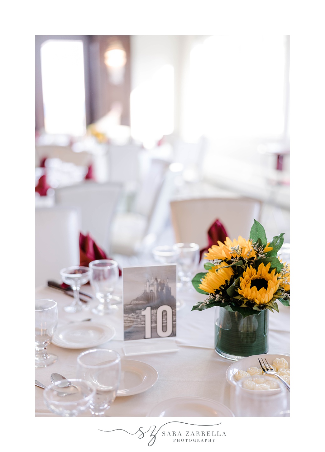 fall wedding reception decor with sunflower centerpieces at Quidnessett Country Club