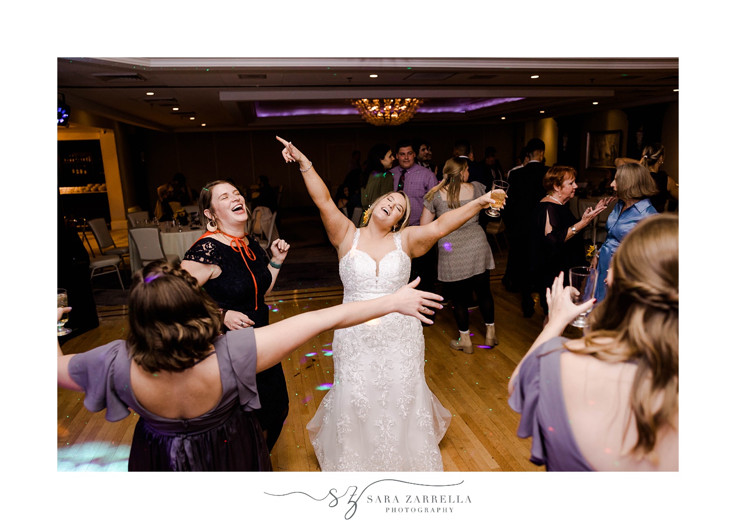 bride cheers dancing during RI wedding reception