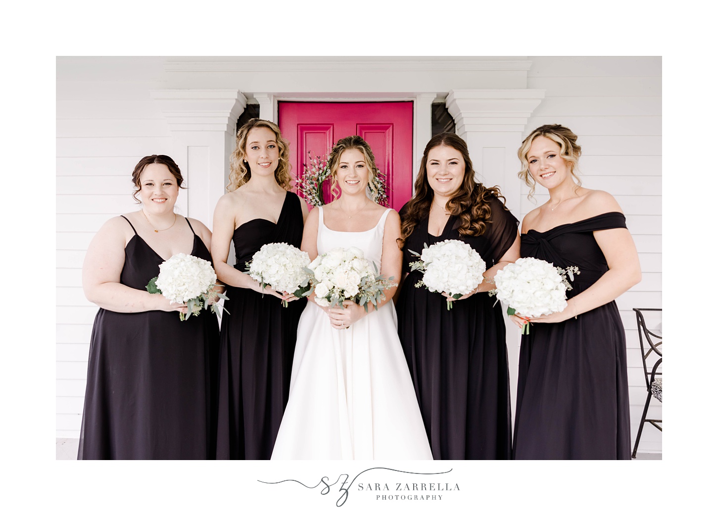 bride stands with bridesmaids in black dresses in Rhode Island 