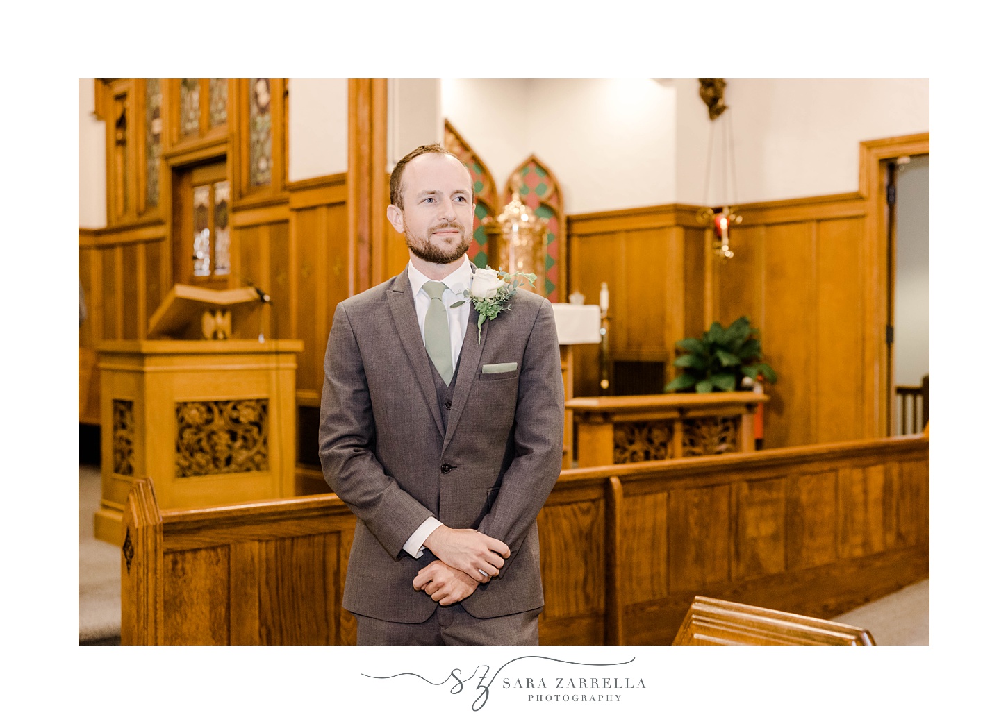 groom stands by wooden altar in Rhode Island church 