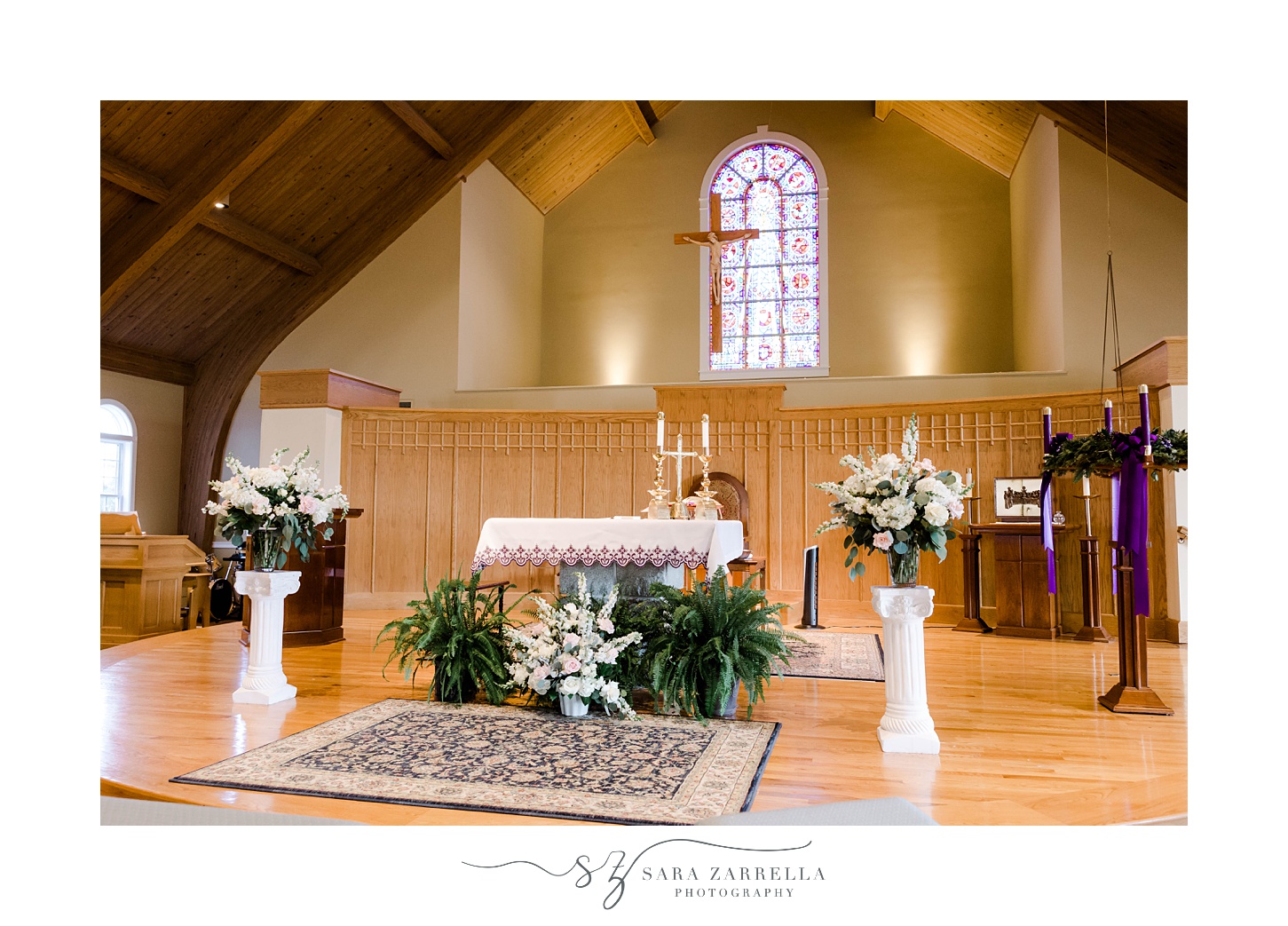 flowers stand on either side of alter 