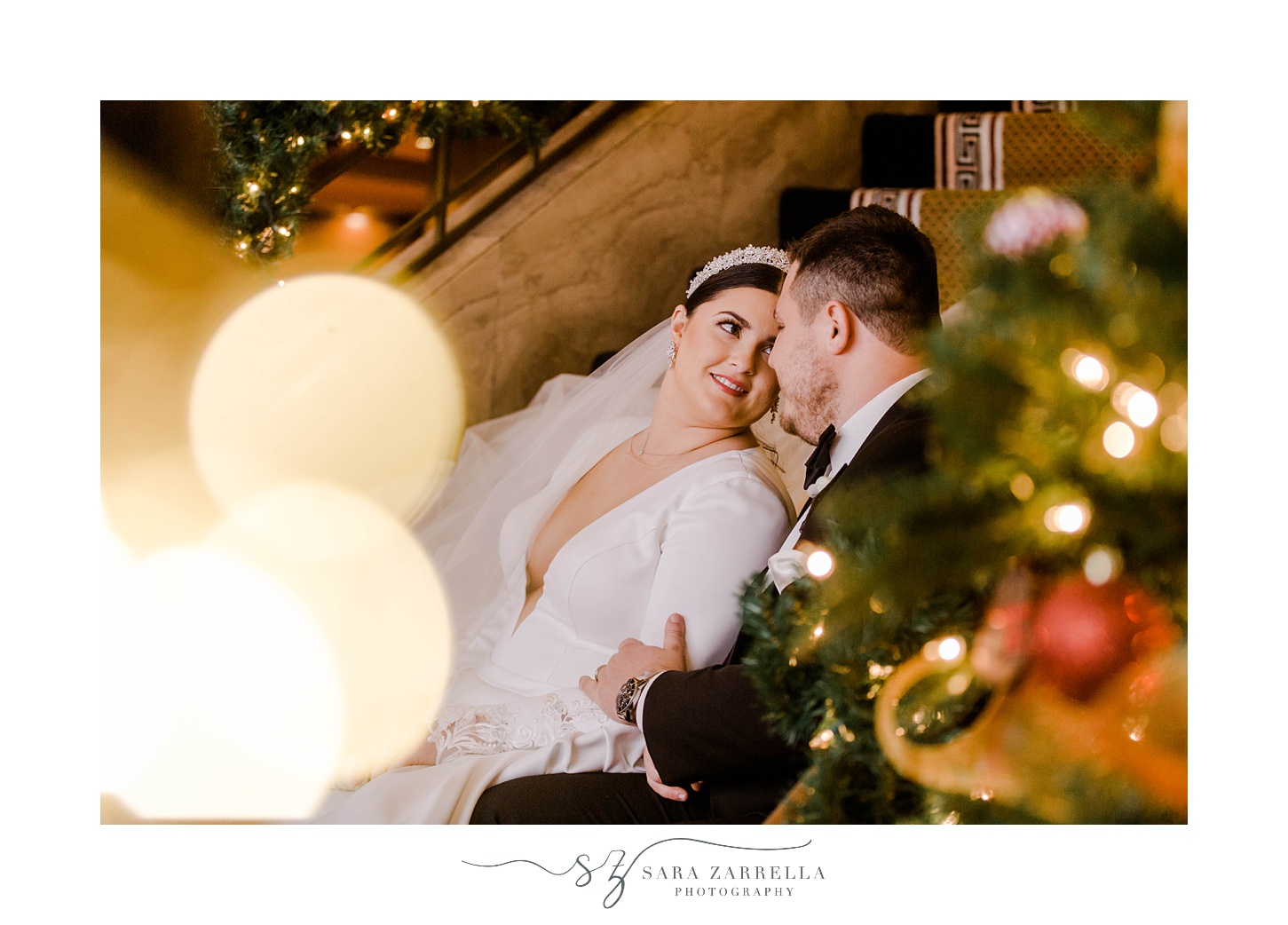 bride leans into groom during Christmas wedding portraits at The Graduate Providence