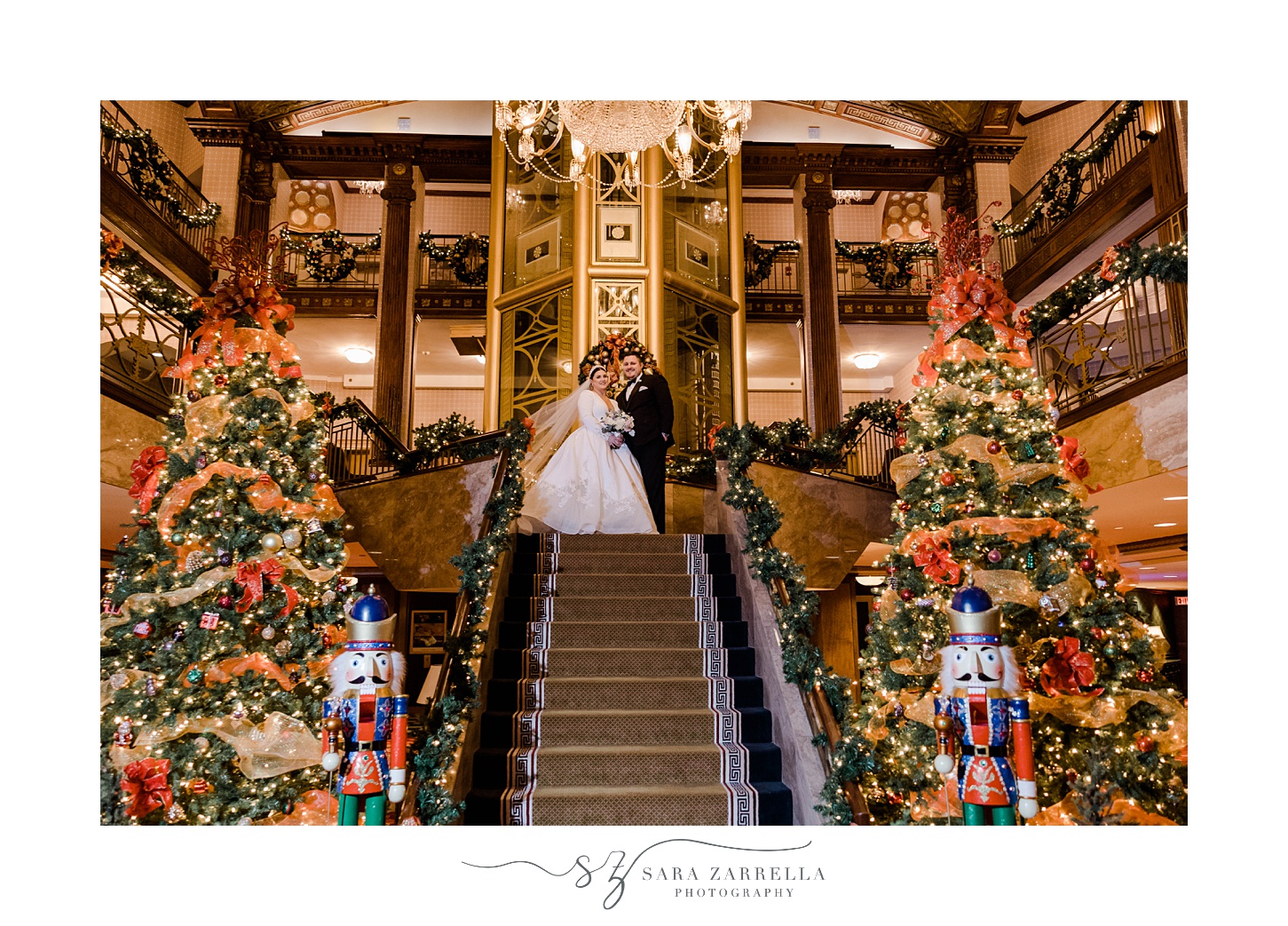 newlyweds stand on the top of the staircase at The Graduate Providence