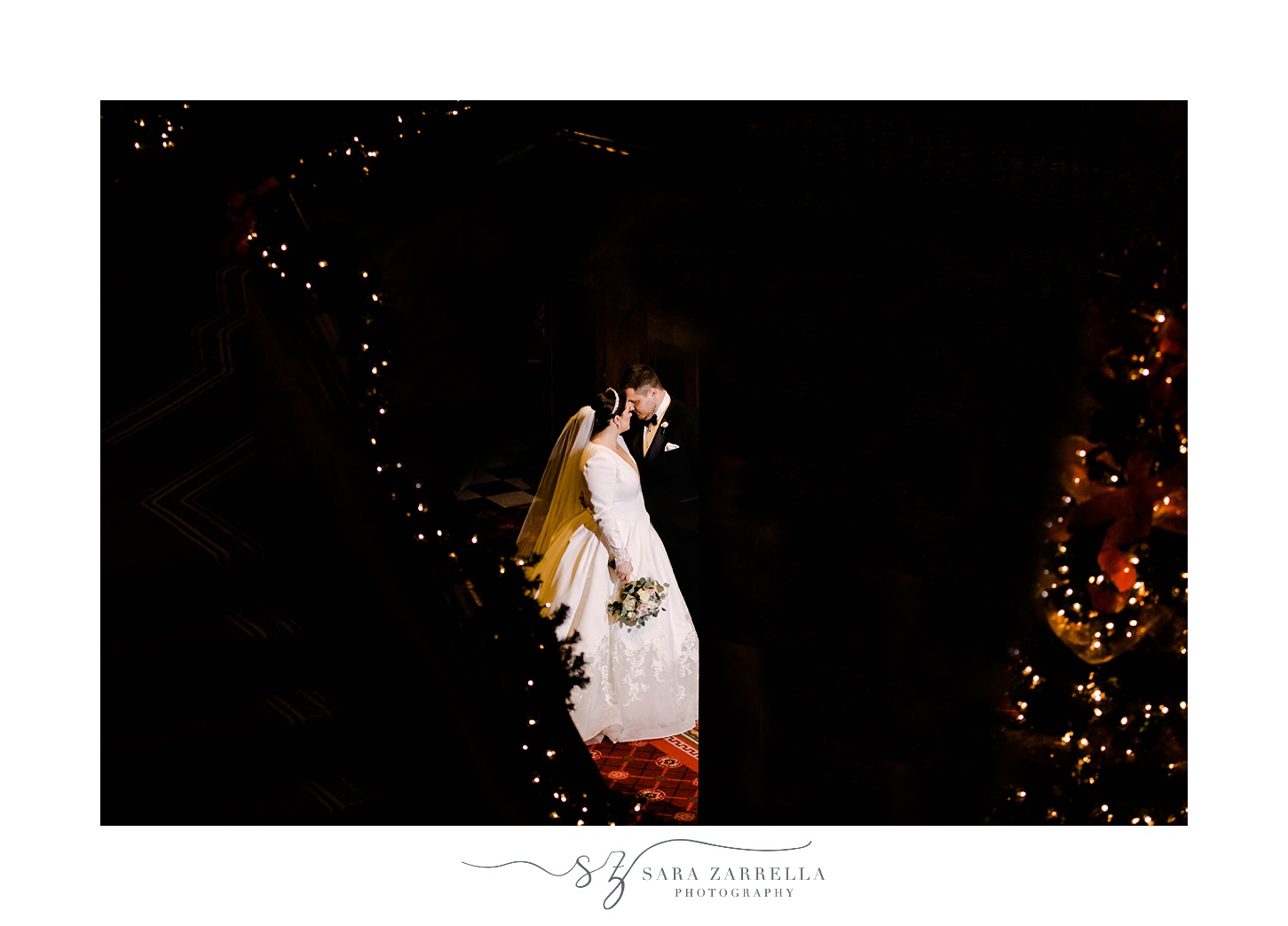 nighttime portrait of bride and groom kissing in providence RI