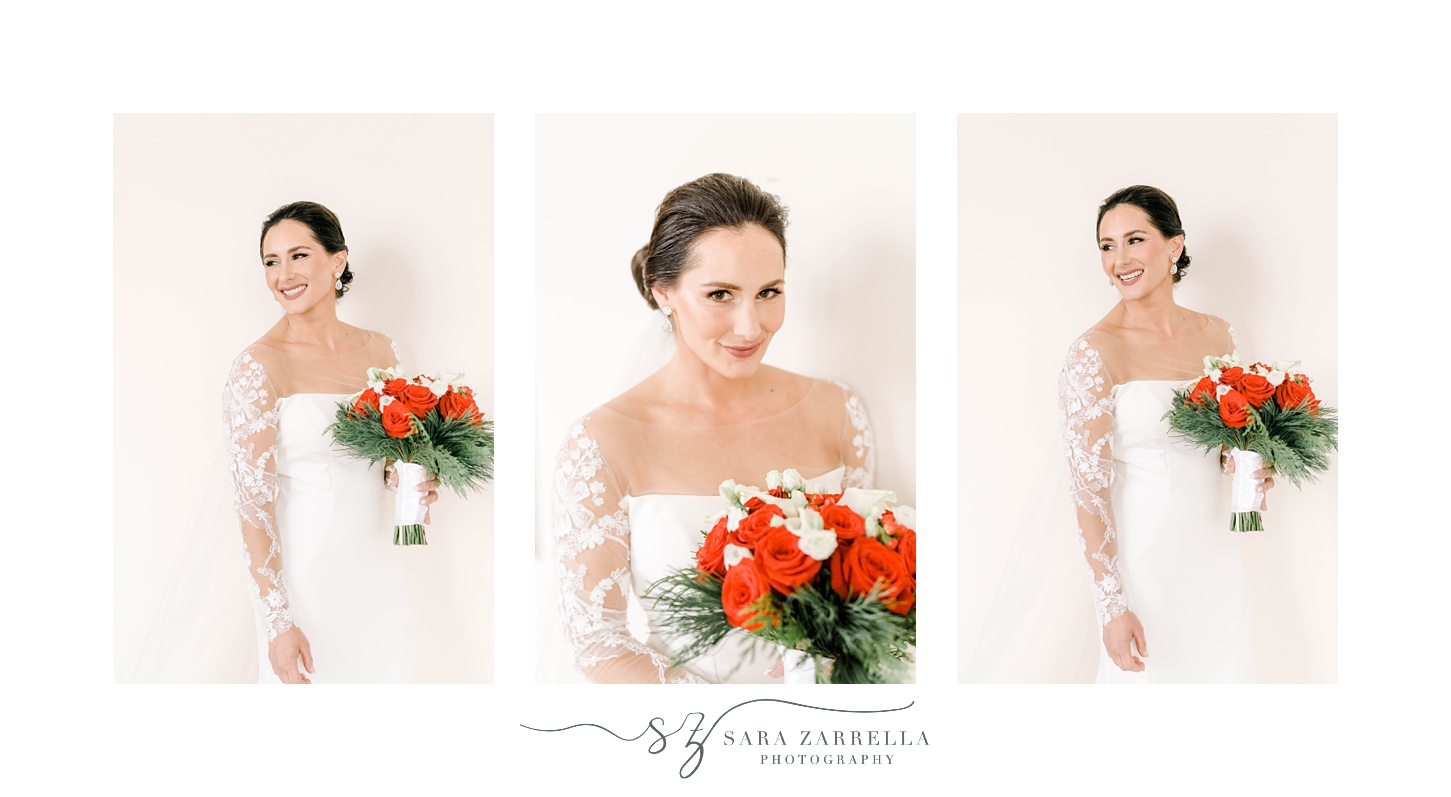 bride poses in wedding gown with lace sleeves with red rose bouquet 