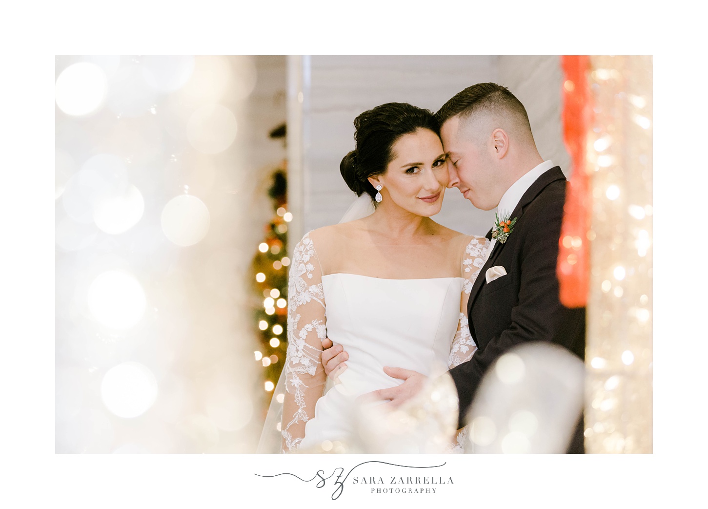 groom nuzzles bride's cheek during portraits under fairy lights at Quidnessett Country Club
