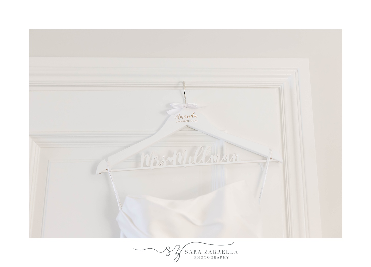 wedding dress hangs on custom white hanger