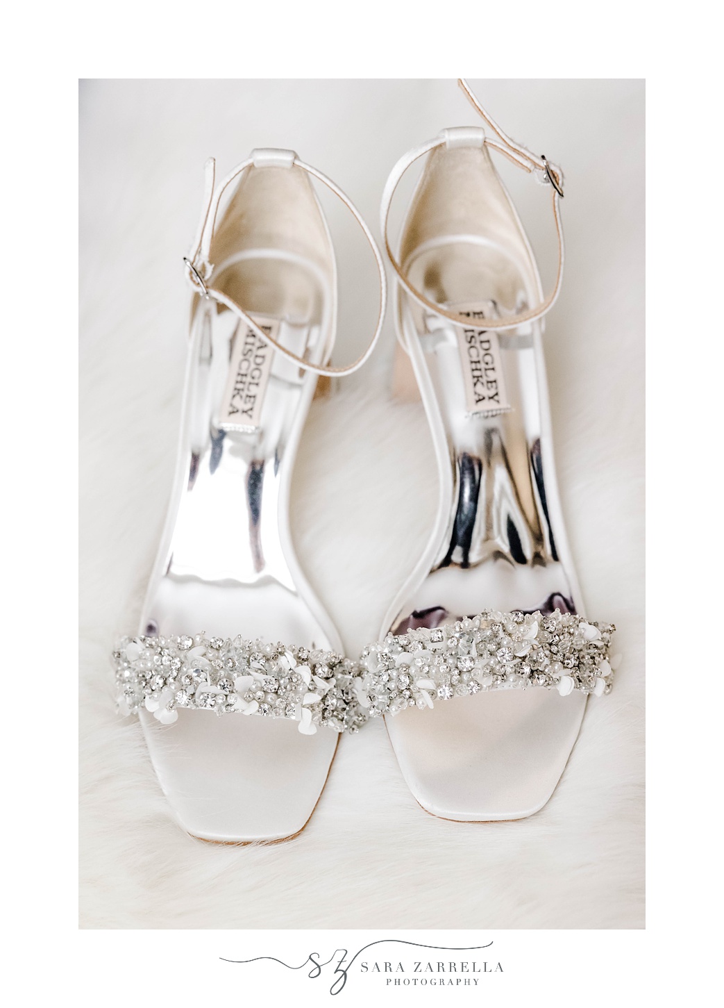 bride's silver shoes with jeweled details 