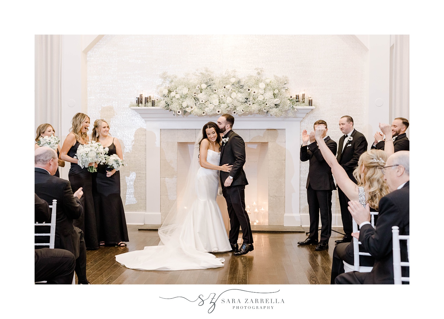 groom kisses bride's forehead during wedding ceremony at The Salon at Belle Mer