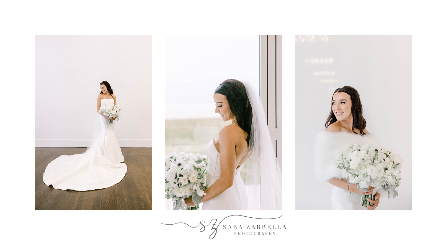 bride poses in front of window and white wall of Belle Mer holding bouquet of white anemones
