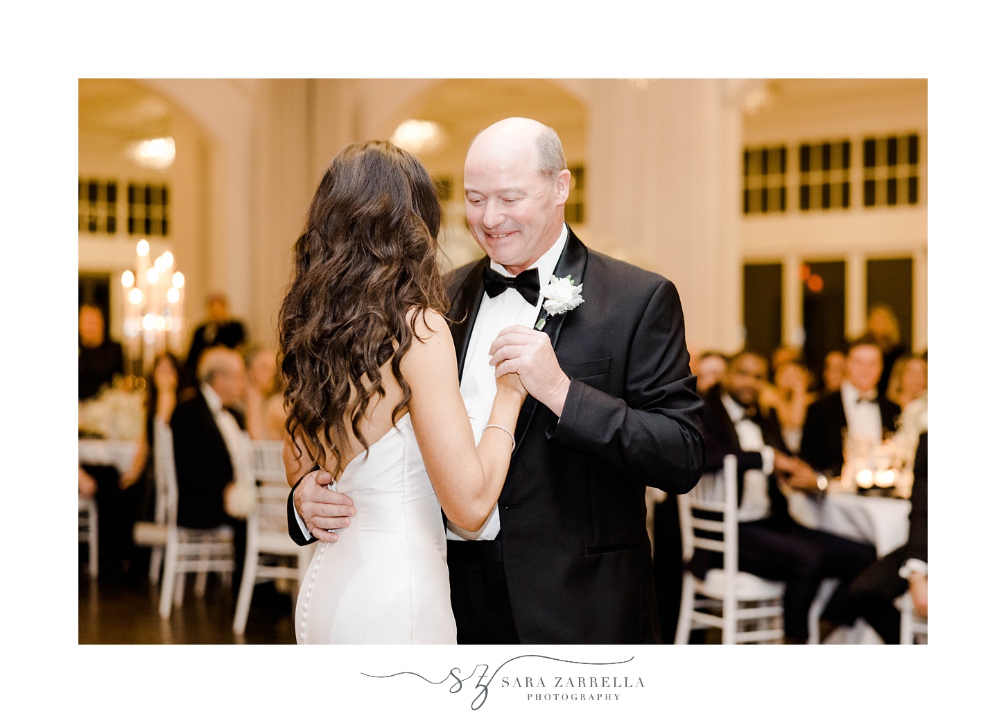 bride dances with father in black tux 
