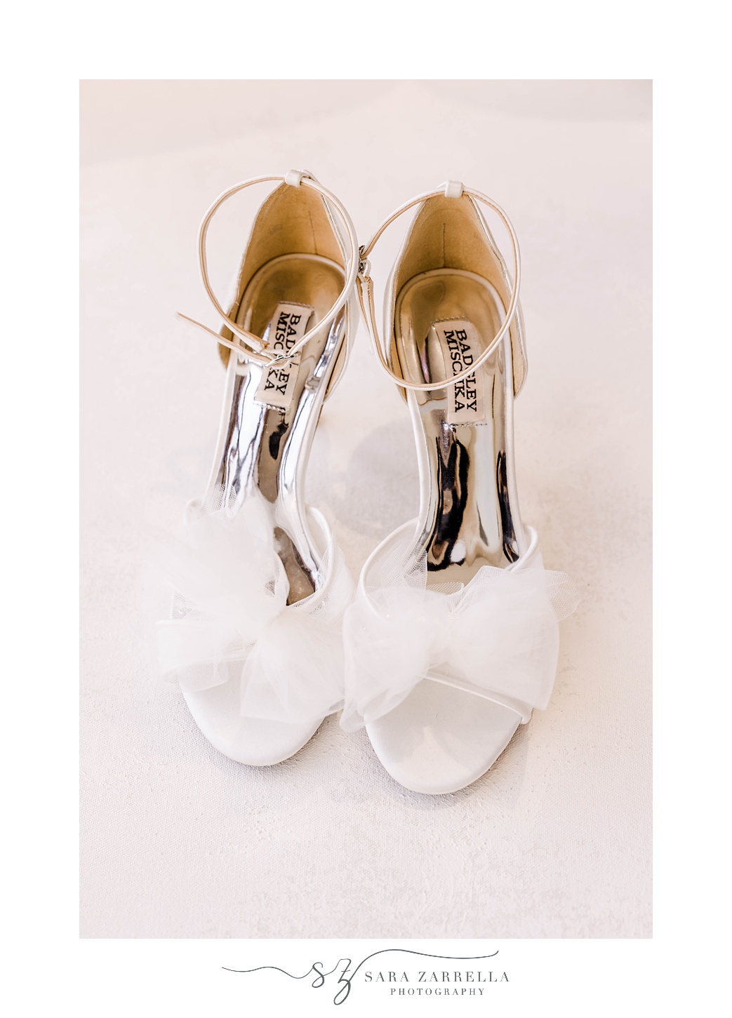 bride's shoes with white gauzy bow