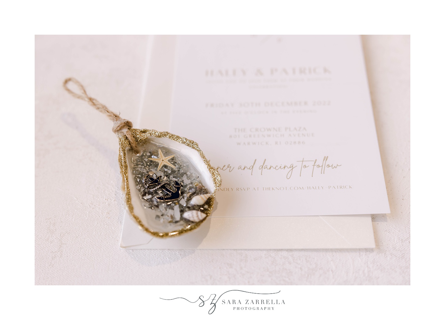 shell ornament lays on winter wedding invitation 