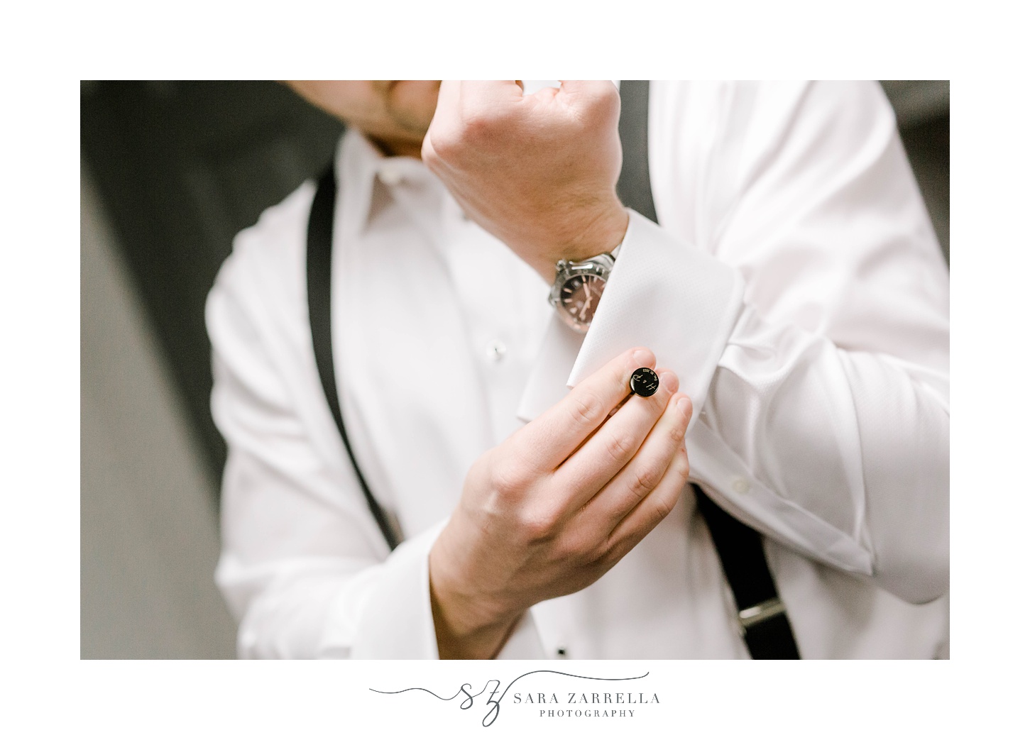 groom adjusts custom cufflinks at Crowne Plaza in Warwick RI