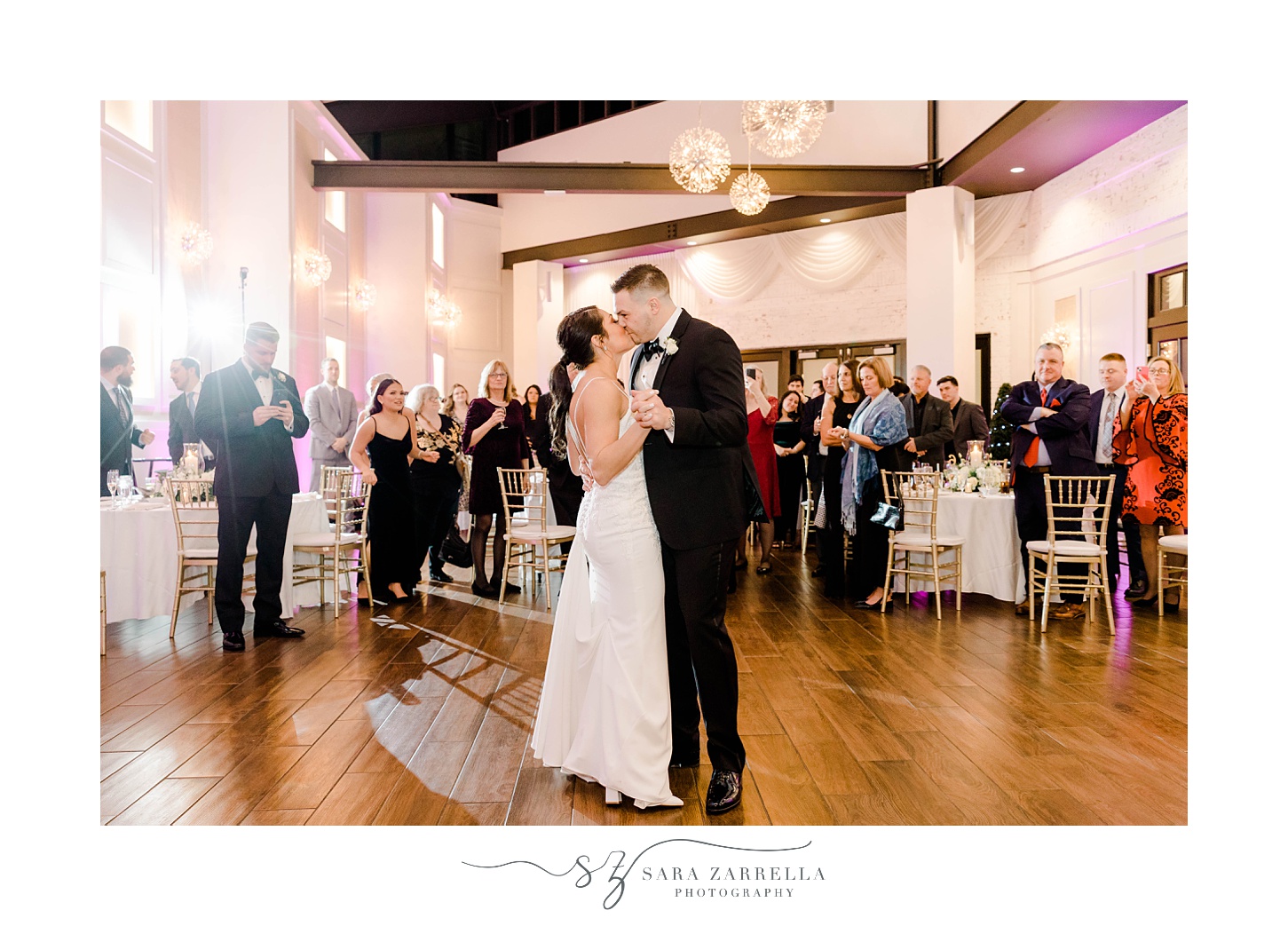 newlyweds dance in atrium during winter wedding reception 