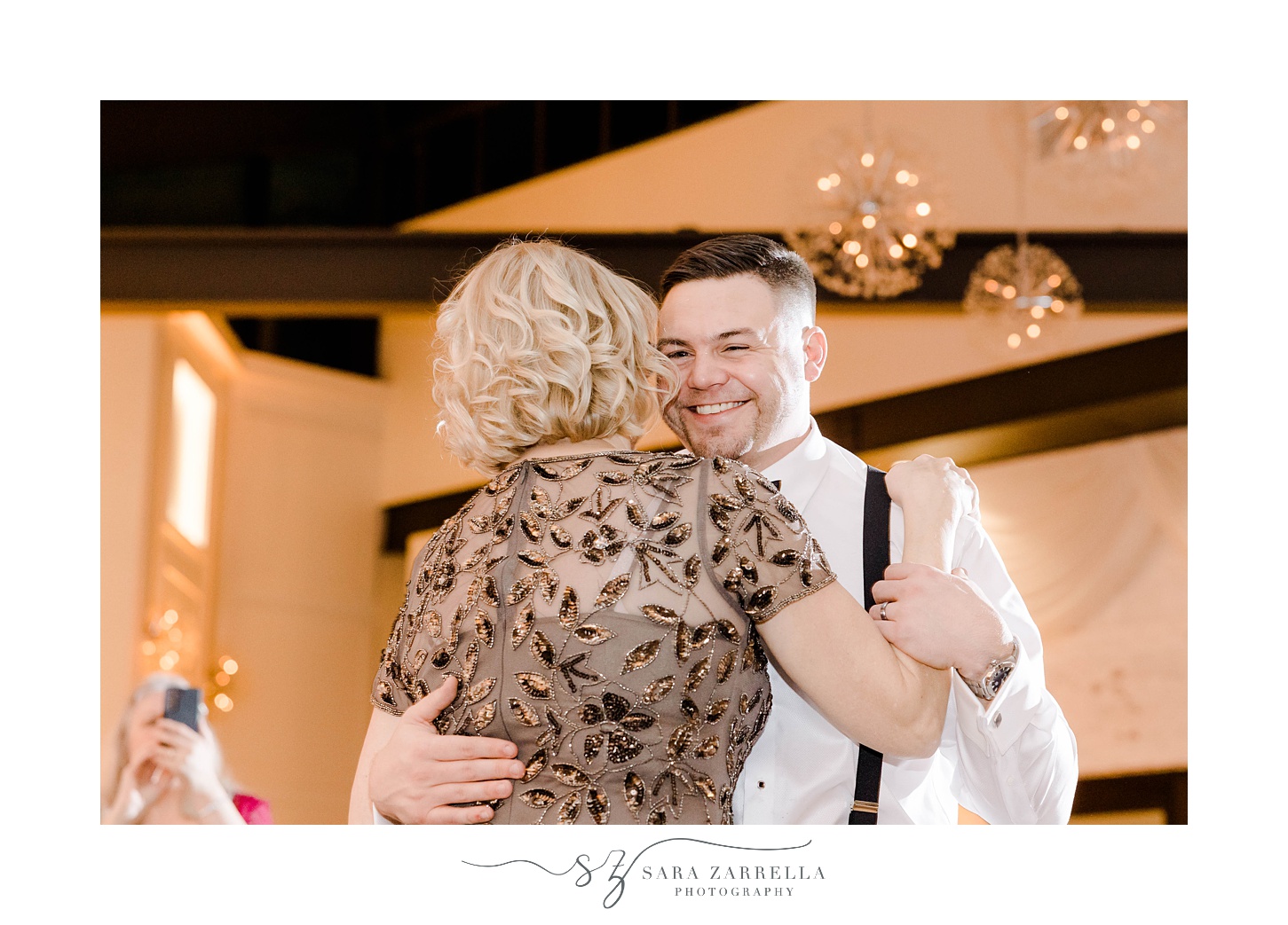 groom hugs mother smiling during during dance at RI wedding reception
