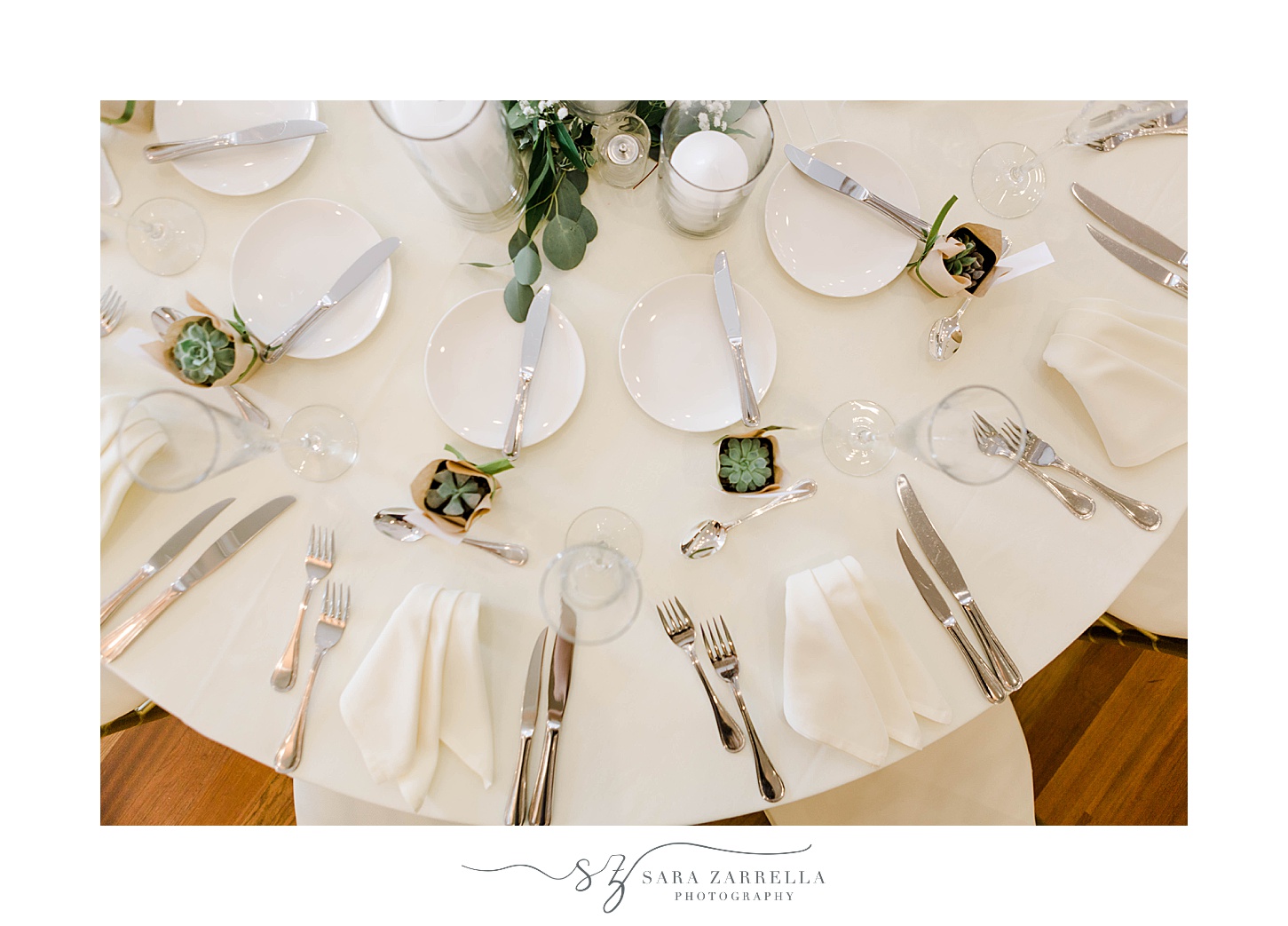 place setting with white napkins and green place cards at OceanCliff Hotel