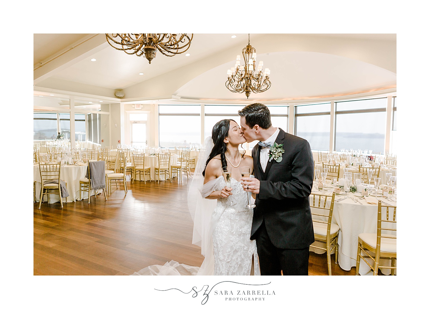 newlyweds kiss during reception at OceanCliff Hotel
