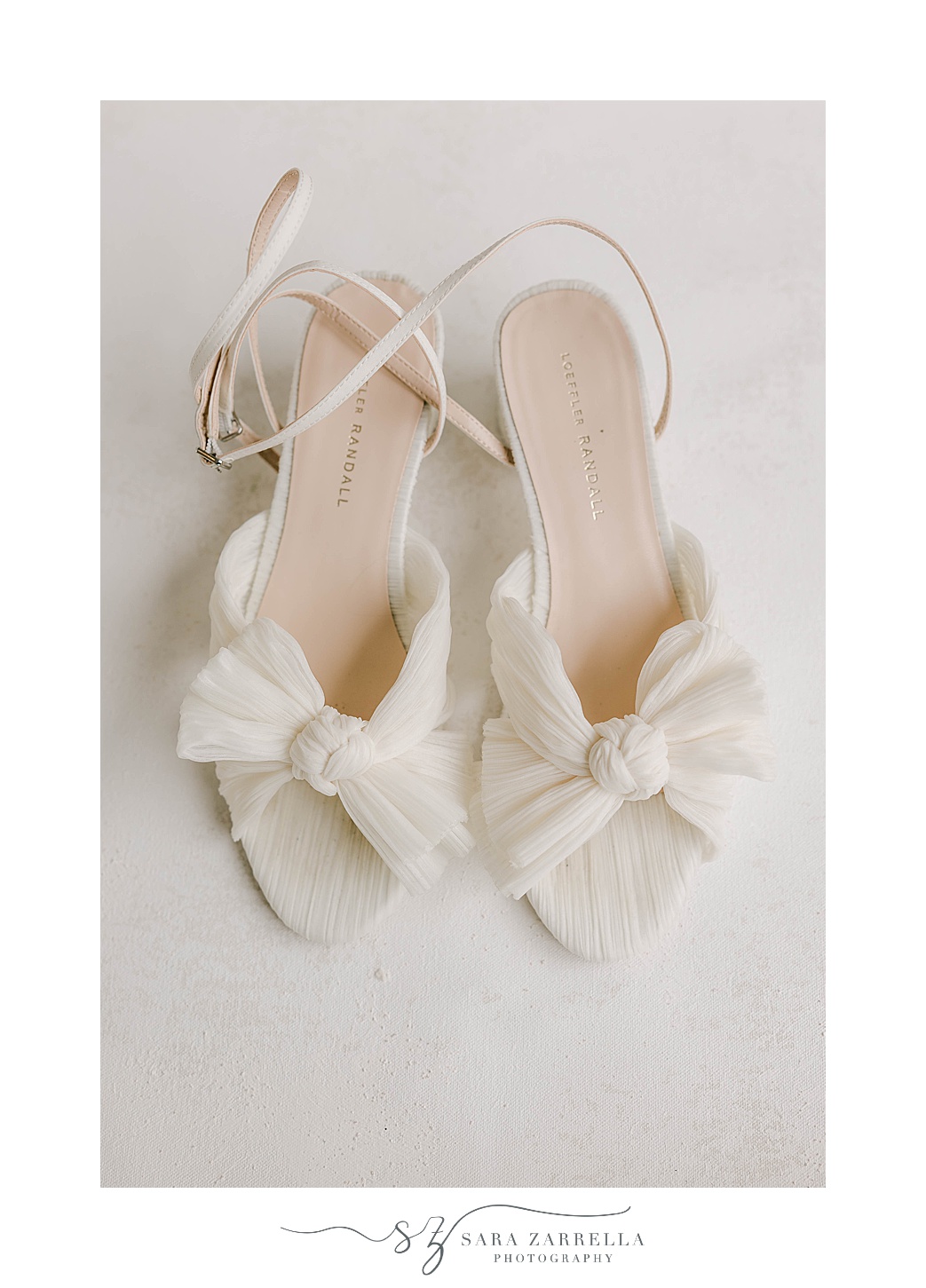 bride's ivory shoes with bows for Belle Mer Island House wedding