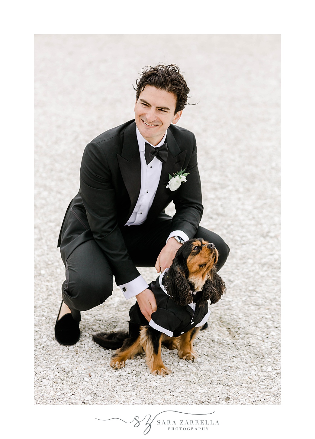 groom kneels with dog in tux in Newport RI