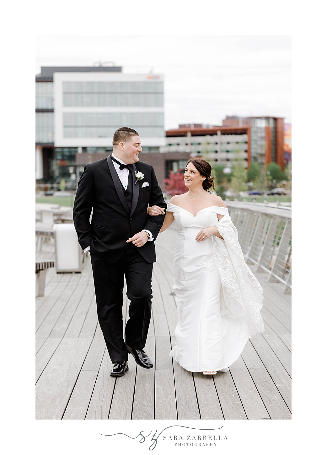 bride and groom walk down the Providence Pedestrian Bridge