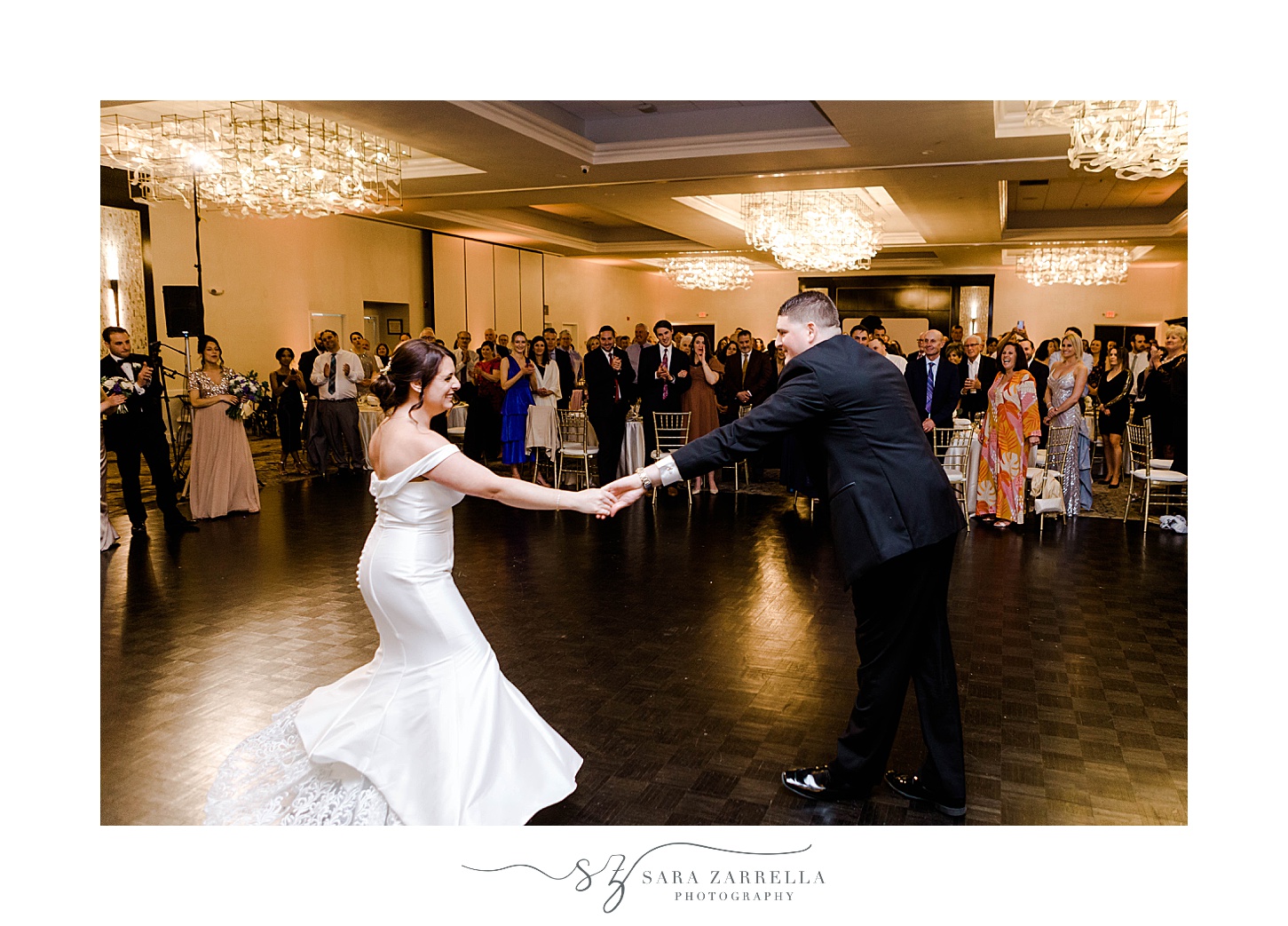 groom twirls bride out during Kirkbrae Country Club wedding reception