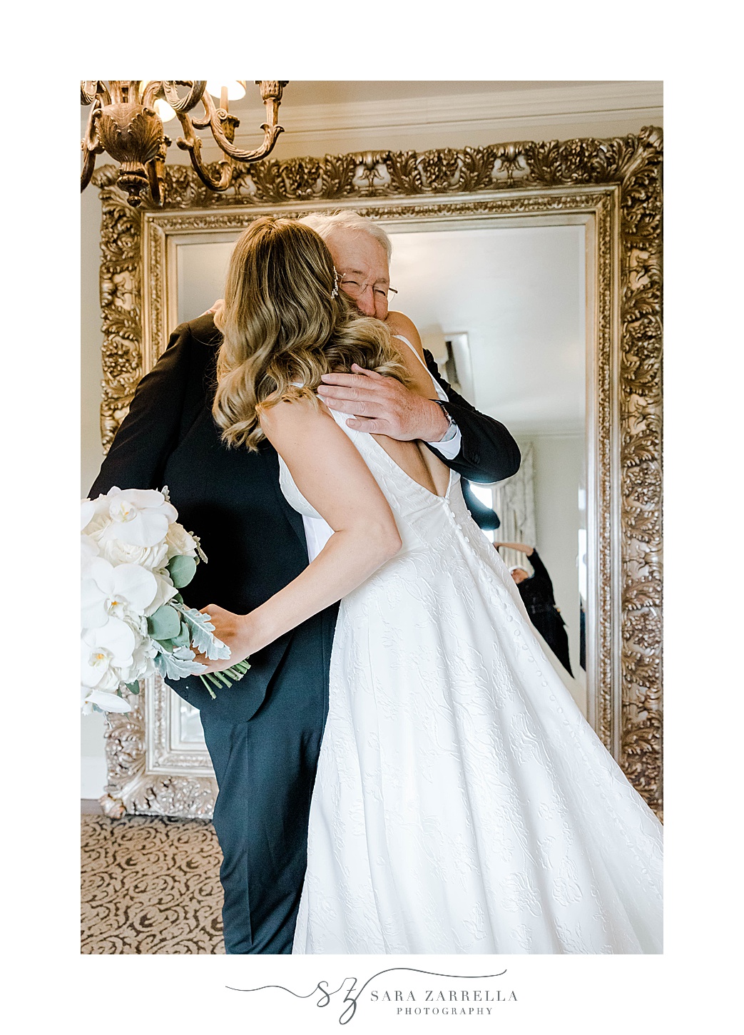 father hugs bride during wedding day prep at OceanCliff Hotel