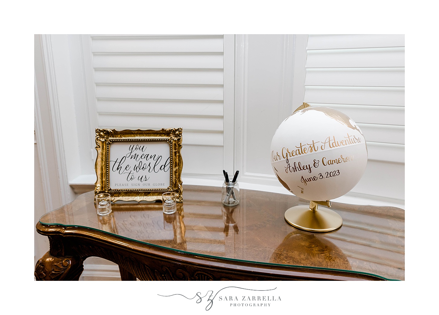 guest book on white and gold globe at OceanCliff Hotel