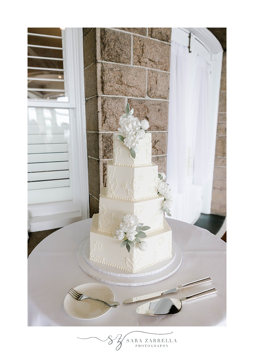 tiered wedding cake with hexagon layers for spring OceanCliff Hotel wedding reception