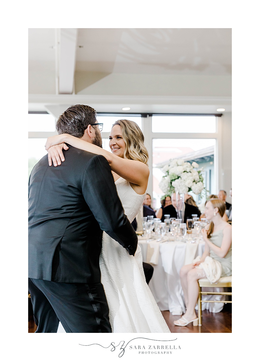 bride and groom dance during spring OceanCliff Hotel wedding reception 