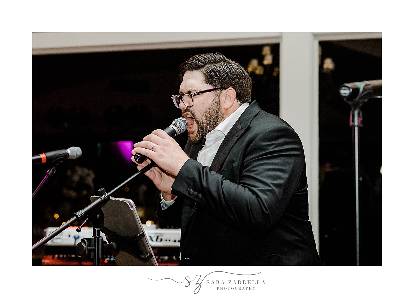 groom sings during wedding reception in Newport RI
