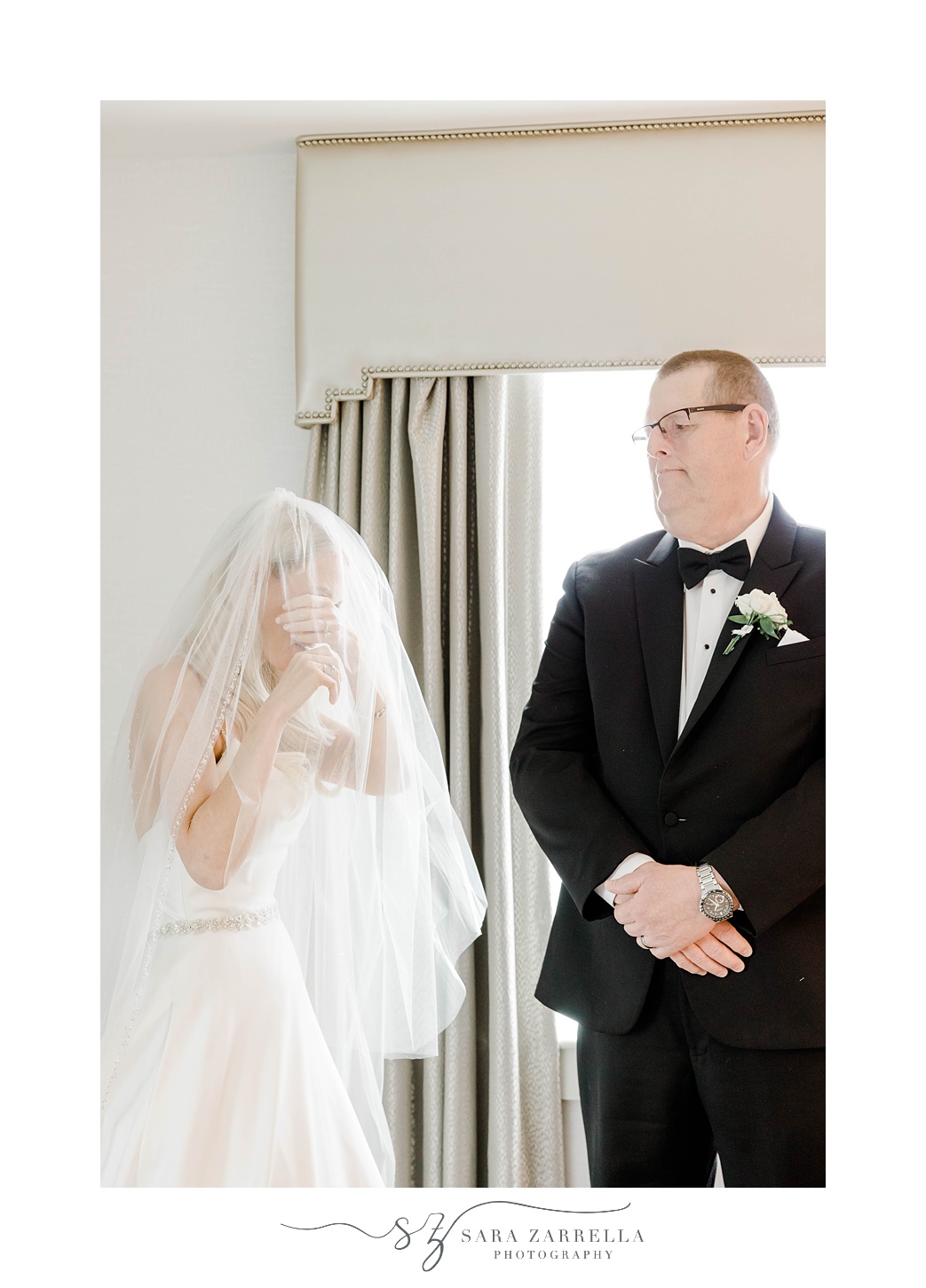 bride cries standing next to dad during first look
