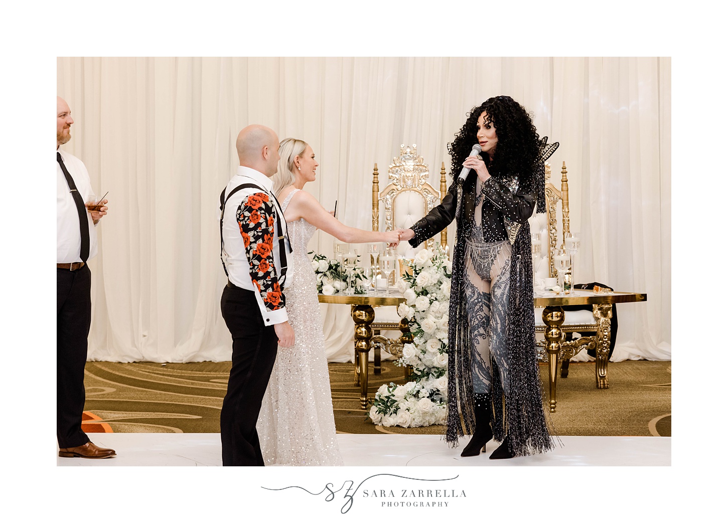 bride and groom meet Cher impersonator during Omni Providence Hotel wedding reception
