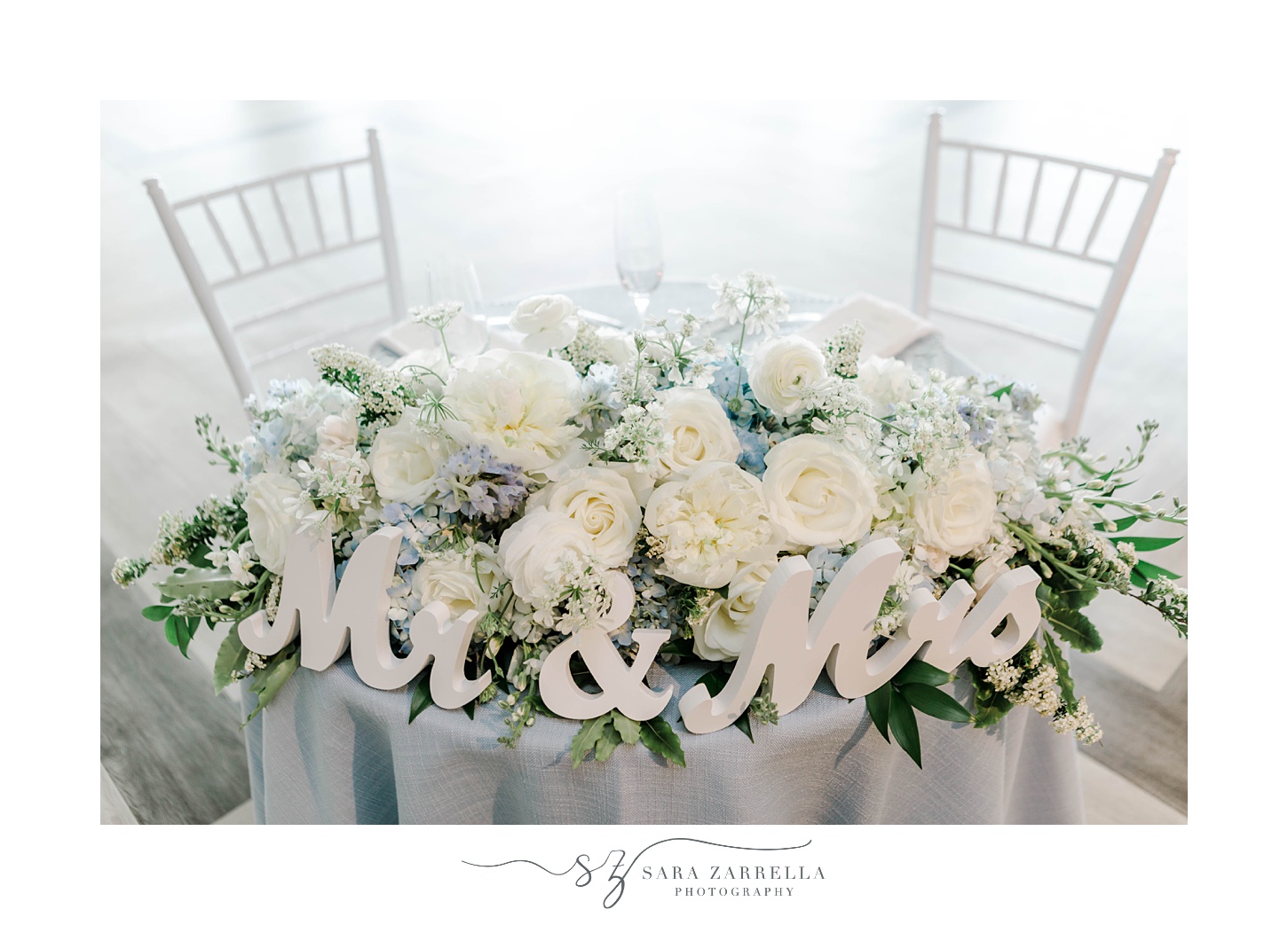 sweetheart table decor Mr & Mrs sign with white roses
