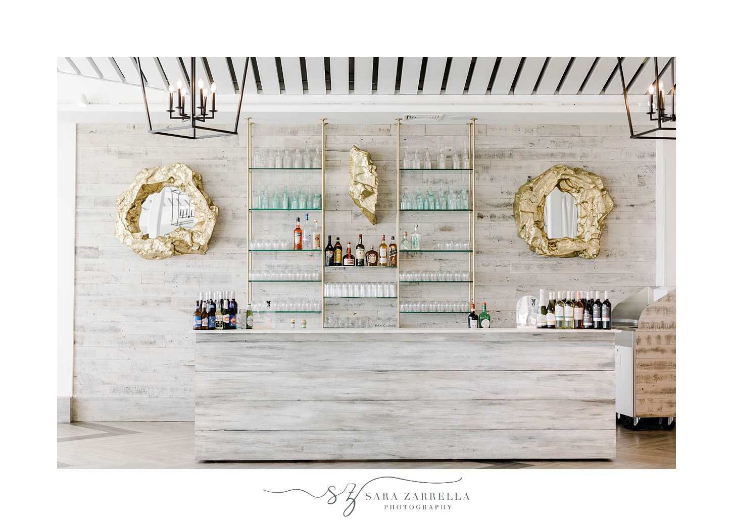 elegant Newport Beach House wedding reception bar with gold and blue accents