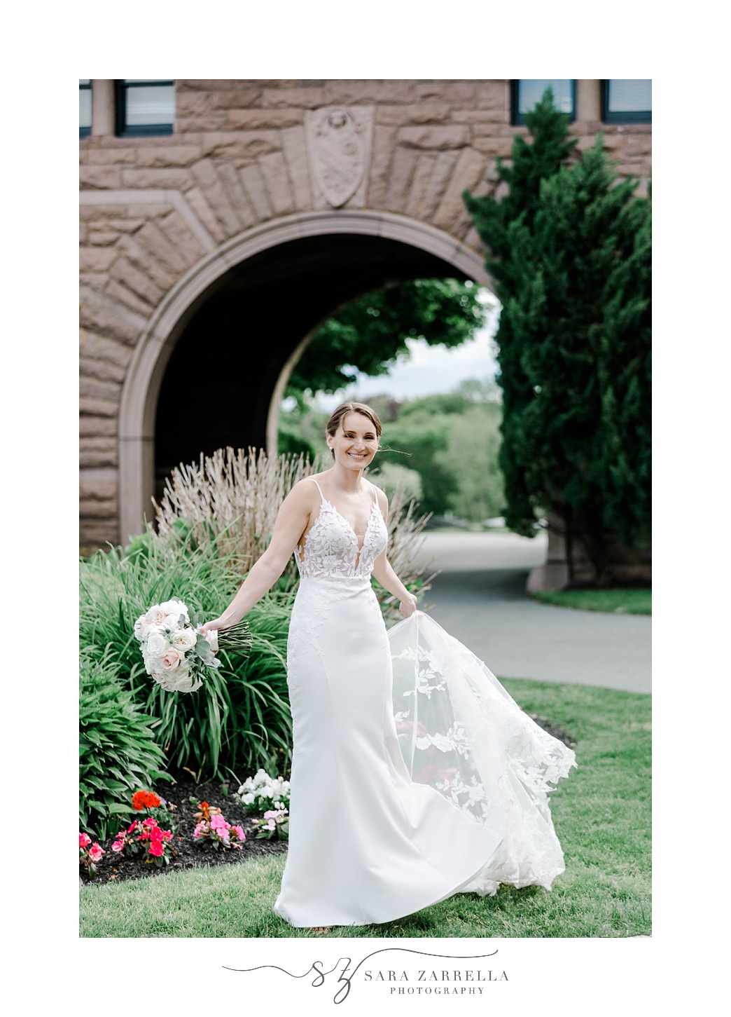bride twirls in wedding dress outside OceanCliff Hotel