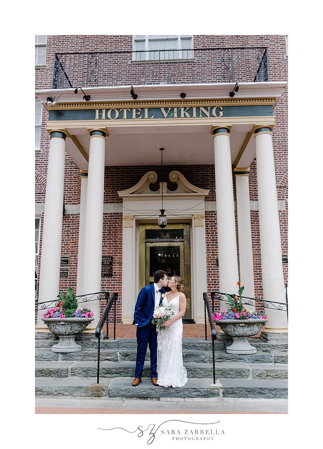 newlyweds kiss on steps the Hotel Viking in Newport RI