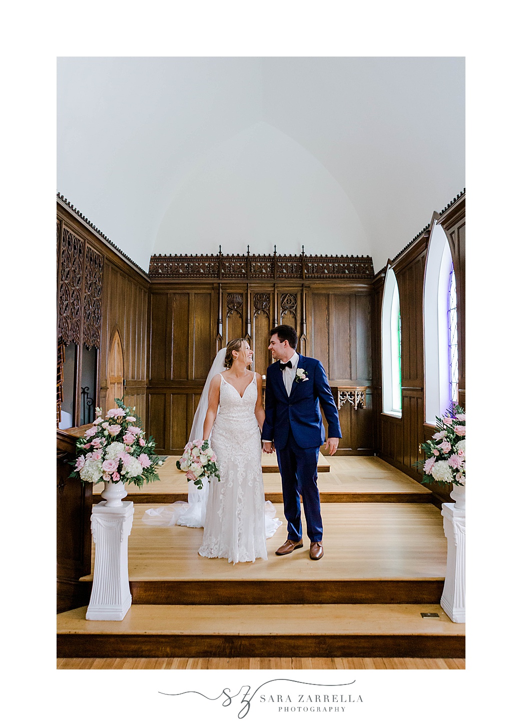 bride and groom smile at alter in Newport church 
