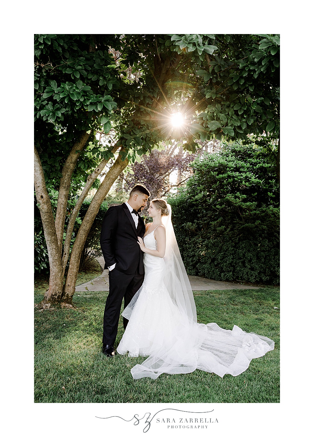 bride and groom stand on lawn at sunset Glen Manor House
