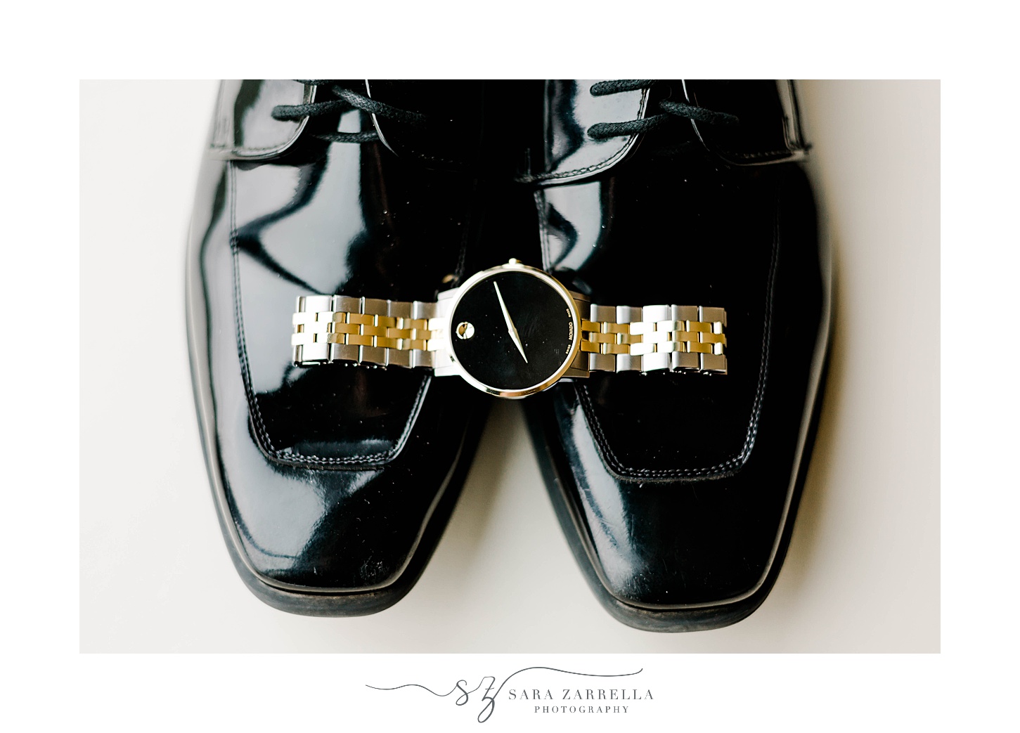groom's black shoes with gold watch