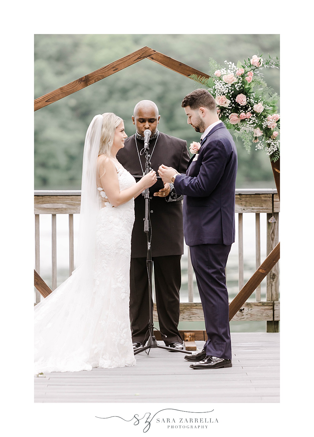 bride and groom exchange vows during waterfront wedding ceremony at Lake of Isles