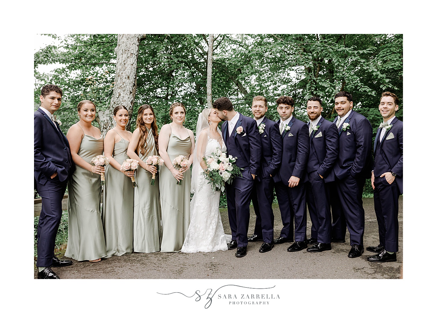 bride and groom stand with wedding party in Stonington CT