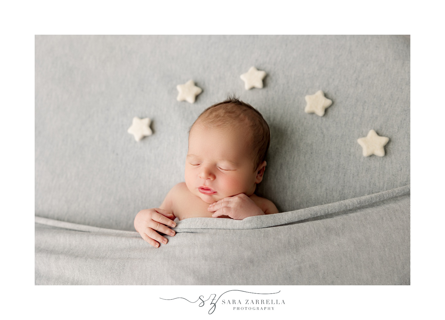 baby sleeps with stars over head during newborn session with Rhode Island newborn and family photographer Sara Zarrella Photography