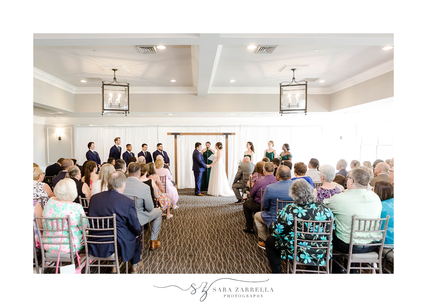 wedding ceremony in ballroom at Harbor Lights