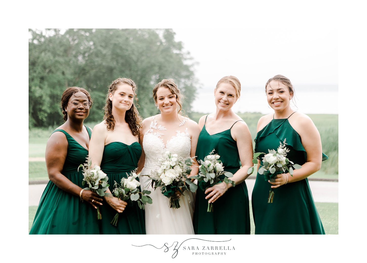 bride and bridesmaids smile together during Rhode Island wedding day 