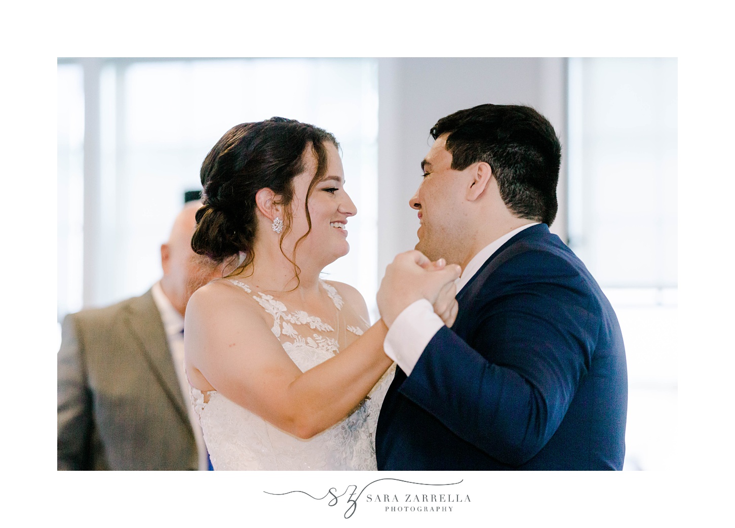 bride and groom smile during RI wedding reception at Harbor Lights