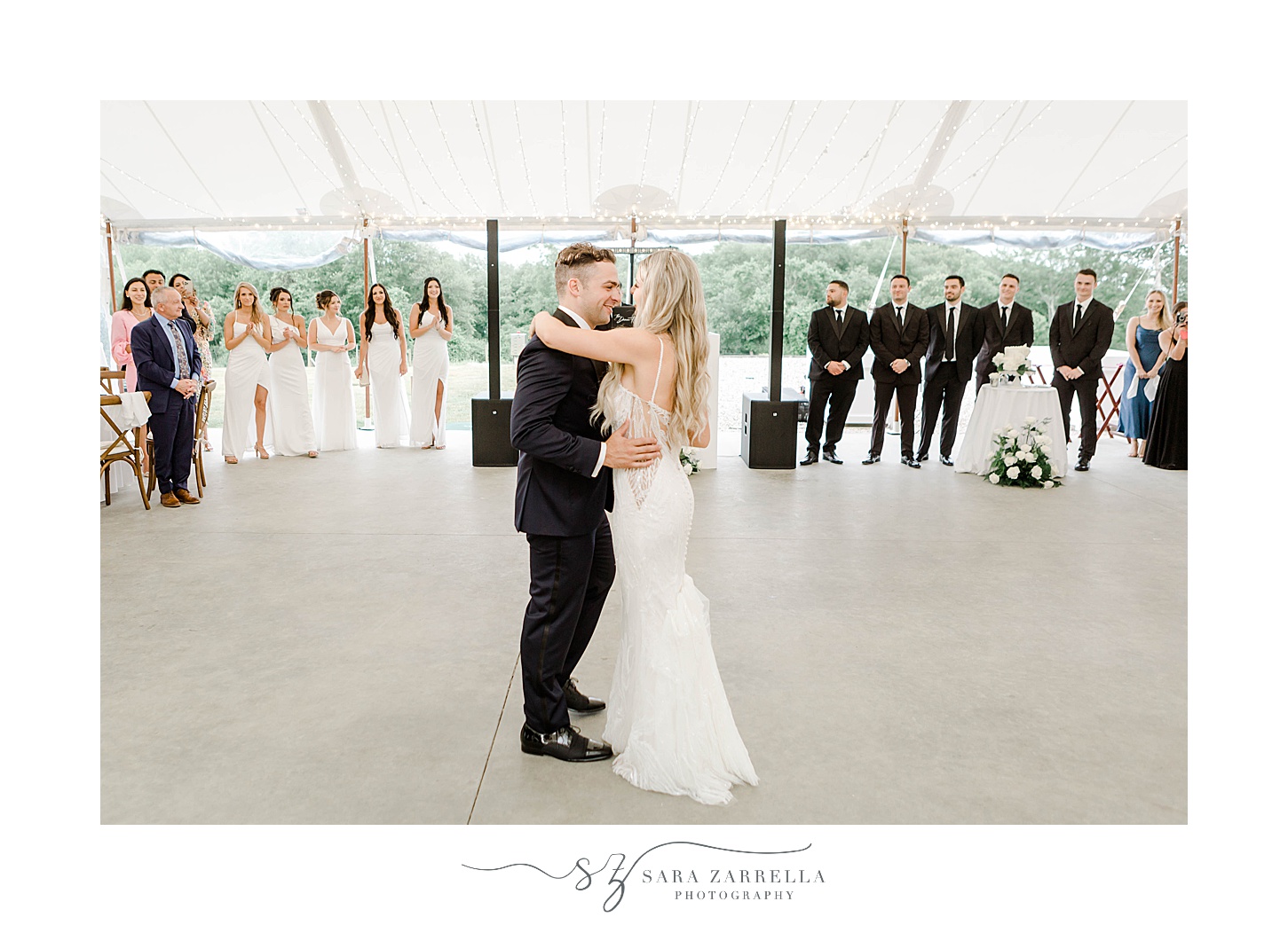 bride and groom dance under tent during wedding reception in Rhode Island at Shepard's Run