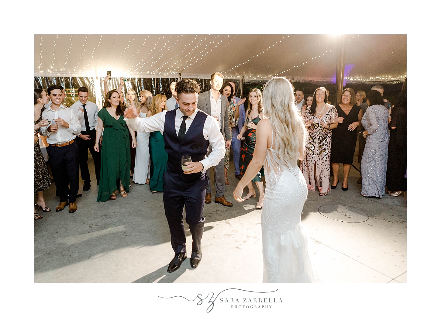 bride and groom dance during RI wedding reception under tent 